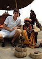 With a snake charmer in Varanasi, India